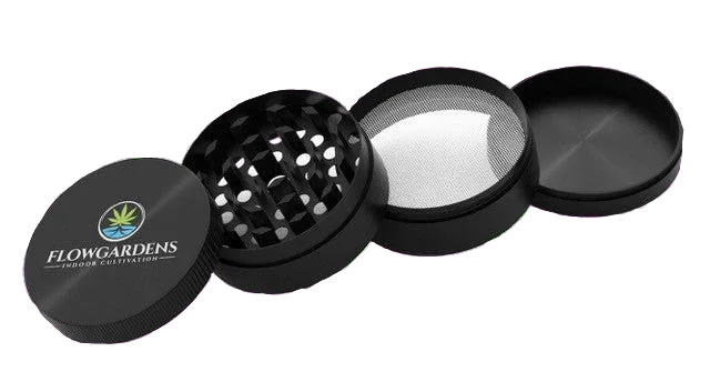 FlowGardens branded four-piece black herb grinder with mesh screen and logo lid