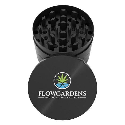 Black herb grinder with Flowgardens logo