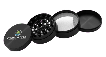 Black herb grinder with 'Flowgardens' logo