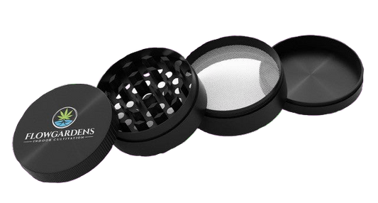 Black herb grinder with 'Flowgardens' logo