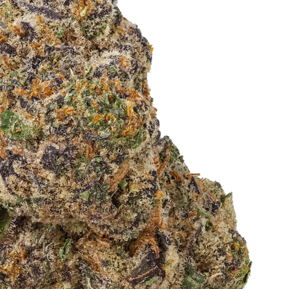 Close-up of a cannabis bud with green, orange, and black colors